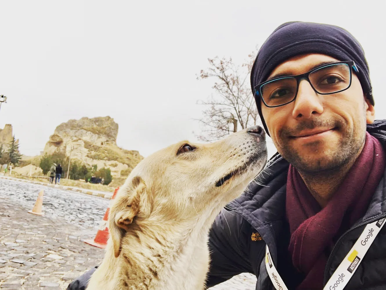 Relaxing with a calico cat on a park bench